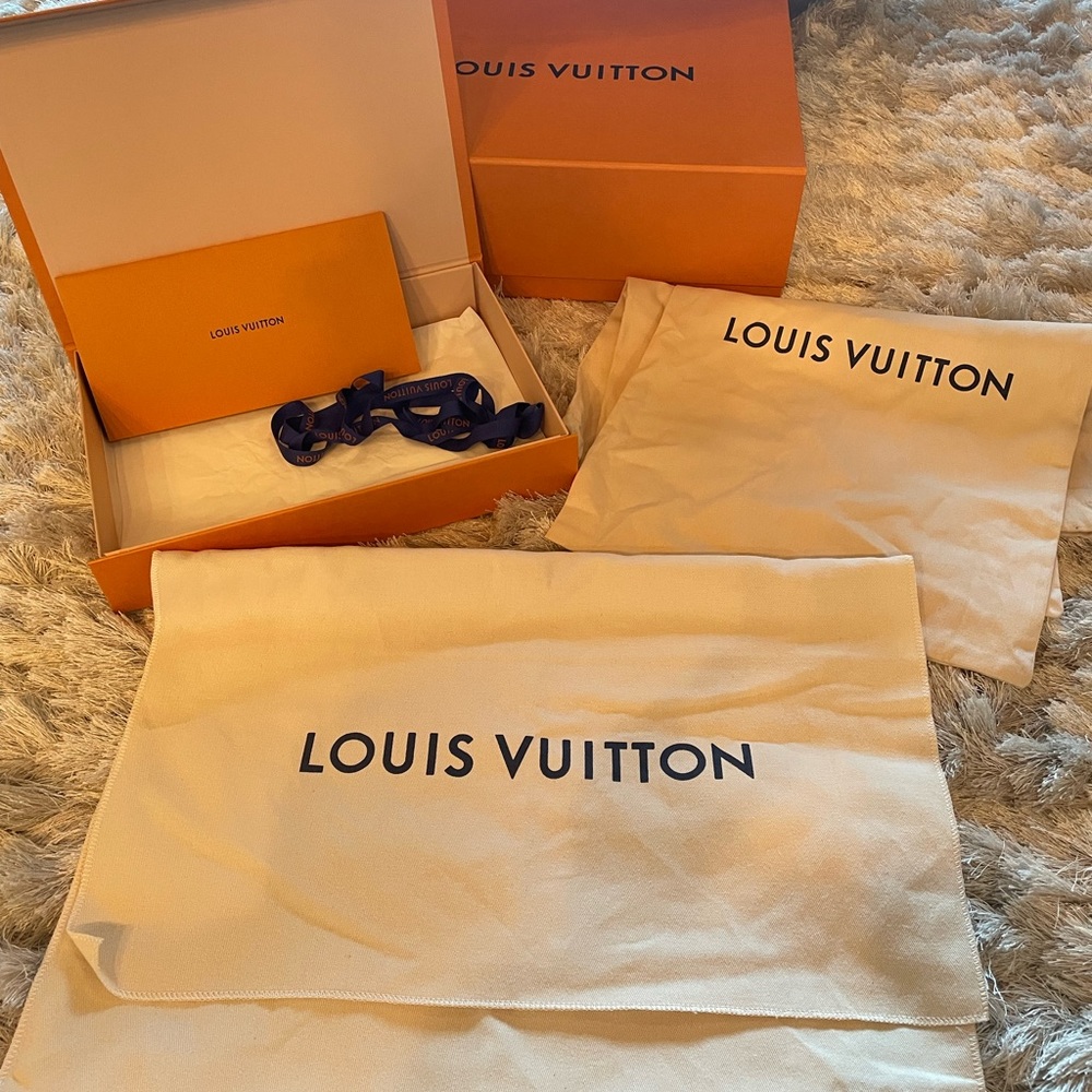 Two Luis Vuitton boxes with 3 dust bags